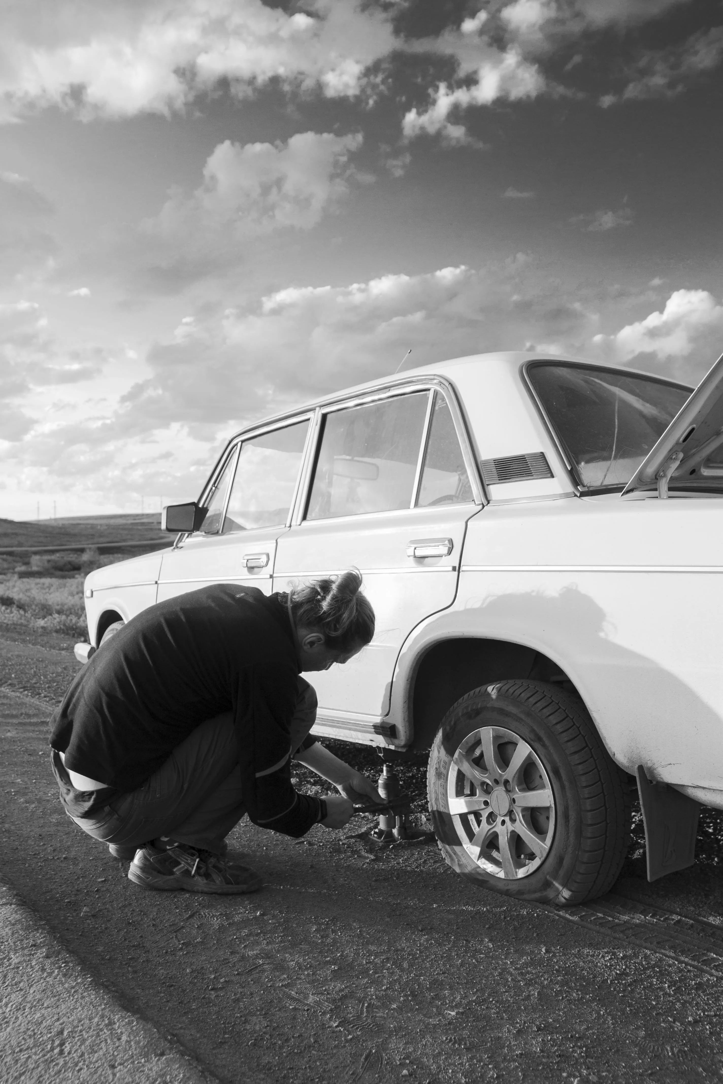 Mechanic performing roadside assistance